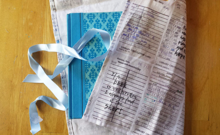 Book gift wrapped with Jane's Words tea towel by Lellobird