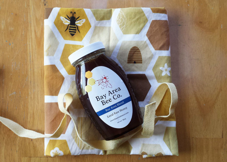Jar of honey gift wrapped with Honeycomb tea towel by Lellobird